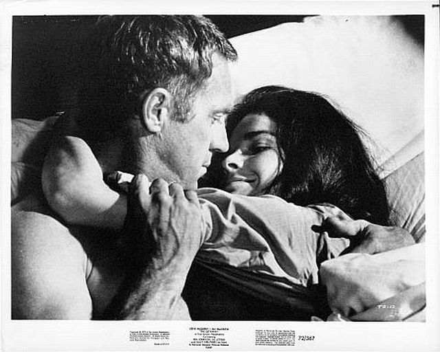 Steve McQueen (as Doc McCoy) and 
Ali MacGraw (as Carol McCoy) in bed